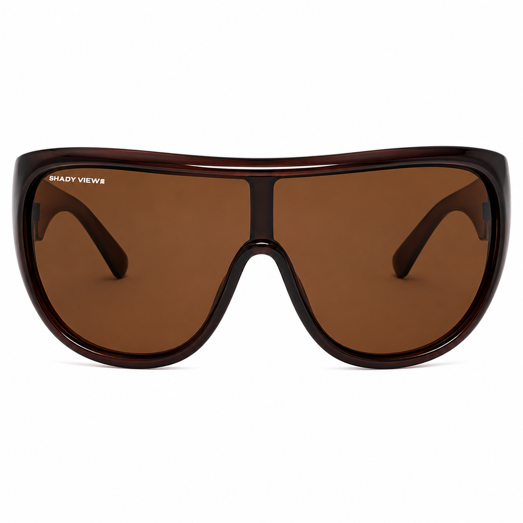 The Muse oversized deep brown shield sunglasses with warm cognac lenses, front view — Shady Views